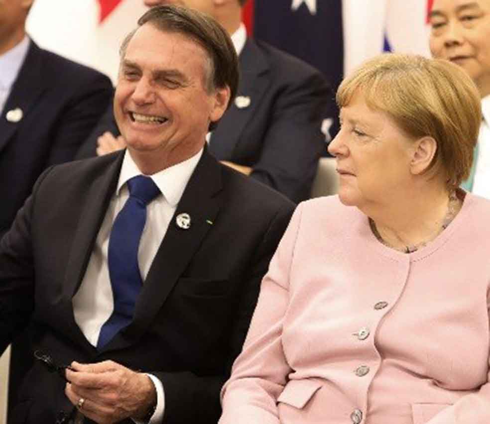 Clima descontraído entre Bolsonaro e Merkel marca jantar do G20